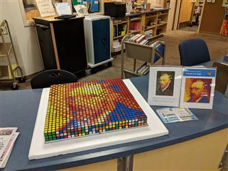 A Van Gogh painting made out of rubiks cubes