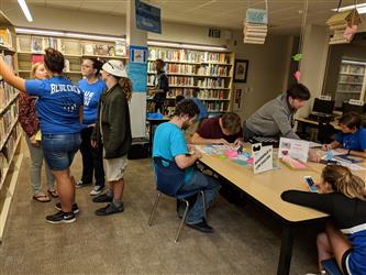 Students looking for books in the library